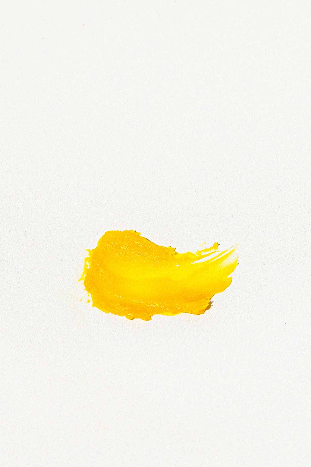 A small dab of Good Flower Farm’s Golden Glow Beauty Balm on your skin shines like bright yellow paint on white, promising an instant glow-up.