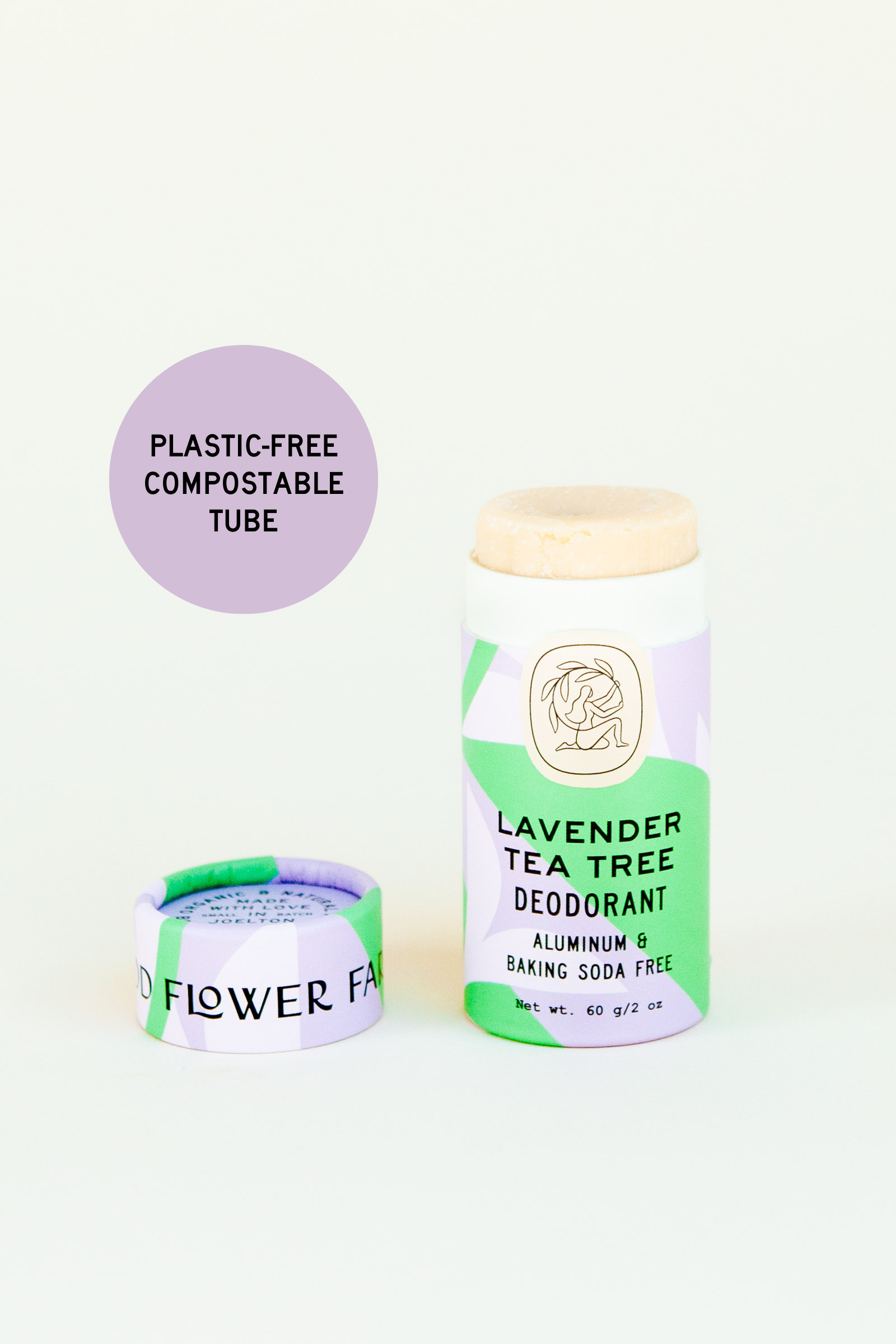 A lavender and green Good Flower Farm Lavender Tea Tree Deodorant Plastic-Free Tube is shown uncapped to reveal its contents. A round label highlights its eco-friendly, compostable design as a natural, aluminum-free choice.
