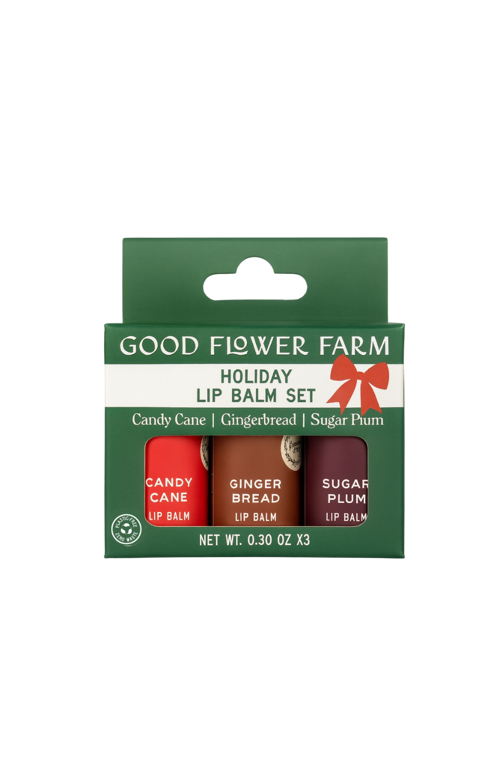 The SEASONAL LIMITED Holiday Lip Gift Set - NEW by Good Flower Farm is a green box with three eco-friendly lip balms—Candy Cane, Gingerbread, and Sugar Plum—in red, brown, and purple tubes.