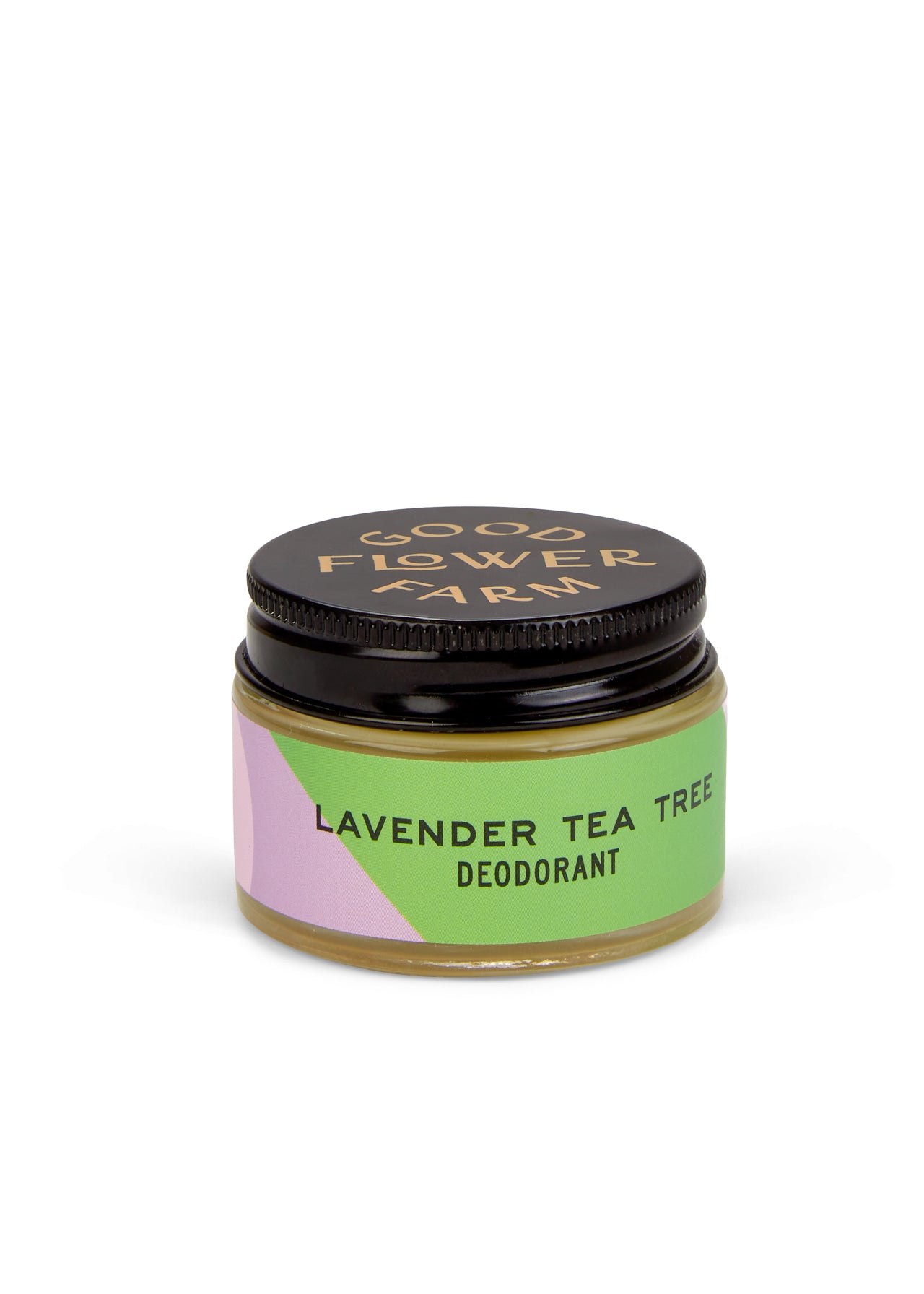 A small glass jar of Good Flower Farm Lavender Tea Tree Deodorant, made for sensitive skin. It has a black lid, pastel green, pink, and purple label with the product name in black. Includes a bamboo applicator and is aluminum-free.