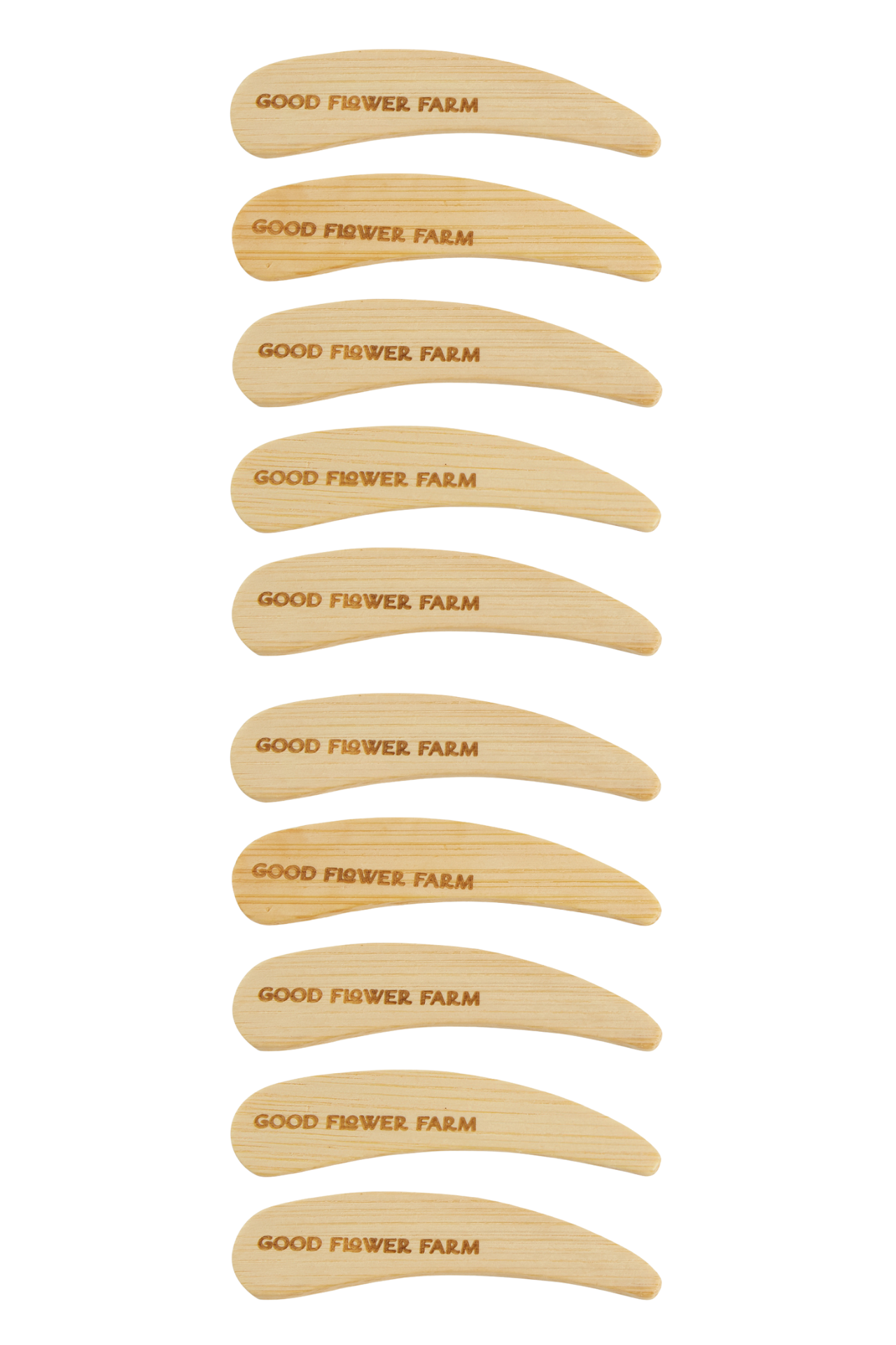 The Reusable Bamboo Spatula - Set of 5 or 10 by Good Flower Farm features identical, washable spatulas engraved in uppercase with the brand name. The spatulas are arranged vertically in the product display.